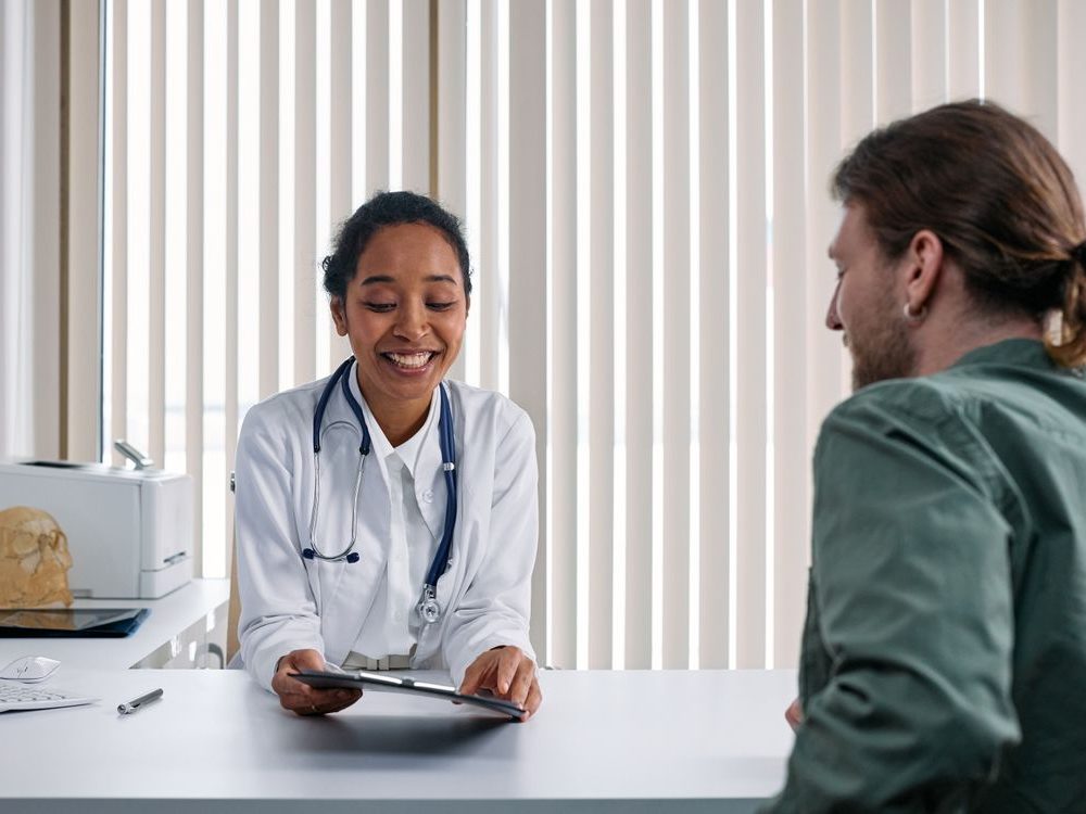 A Nourish Health Life clinician in conversation with a patient